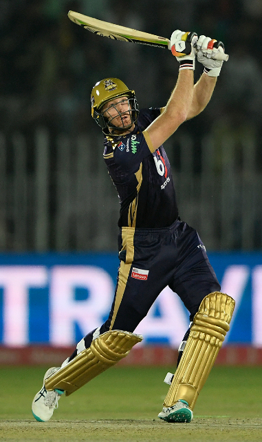 Martin Guptill hits the ball over the boundary line for a six
